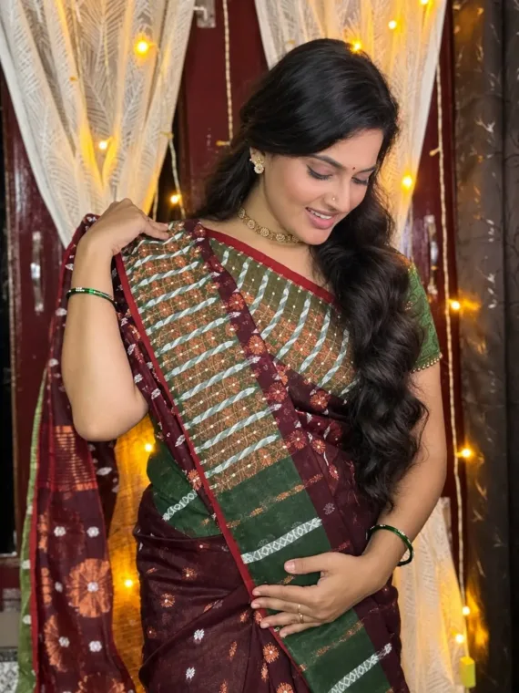 A creator in the weRbangali handloom flower wine-red saree